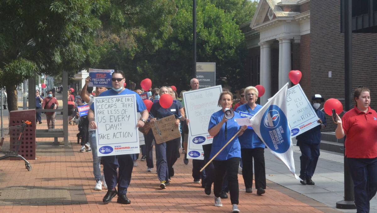 Griffith's hard-working healthcare professionals marched down Banna Avenue before beginning their rally in Memorial Park. PHOTO: Cai Holroyd