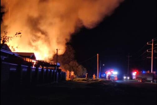 AFLAME: A long-abandoned house on Merrigal Street burnt down just after 4:30 in the morning. PHOTO: Contributed