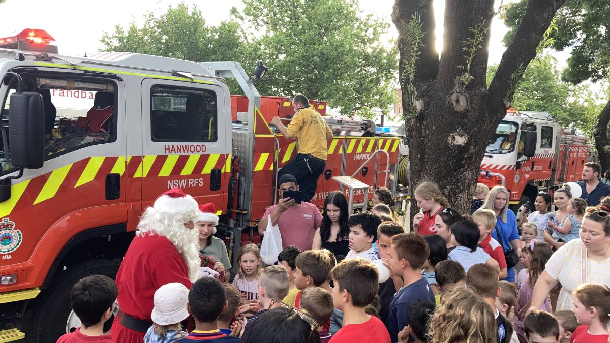 Santa Claus visited Memorial Park to give some early Christmas gifts to the crowds of adoring children. Picture by Cai Holroyd