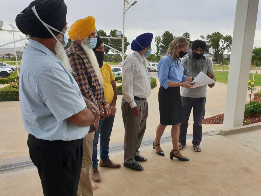PLANS: Narinder Sandhu showed MP Sussan Ley the plans used for the developments. PHOTO: Cai Holroyd