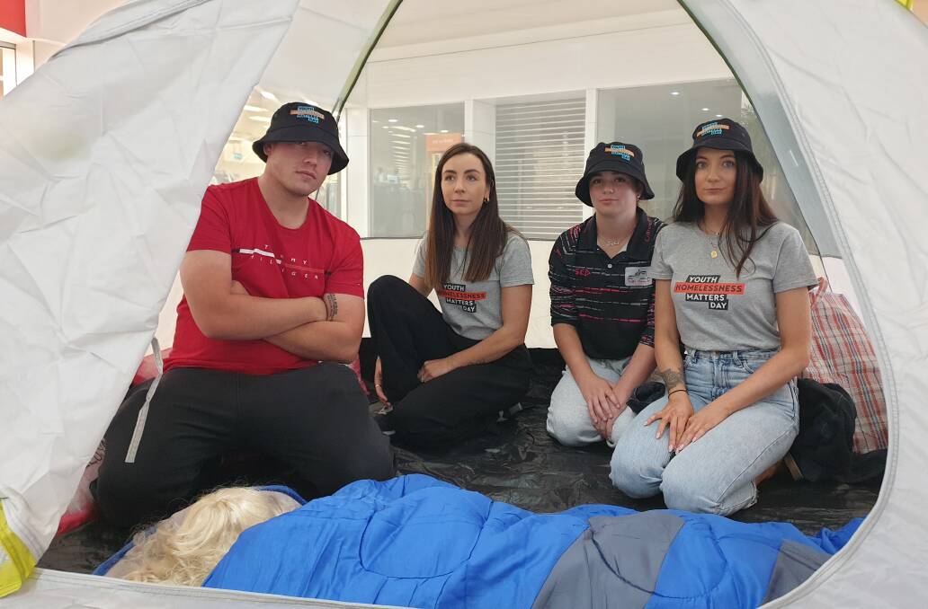 Lawrence Salvestro, Jena Campbell, India Morriss and Stephanie Heath set up a tent in Griffith Central to raise awareness of youth homelessness. Picture by Cai Holroyd