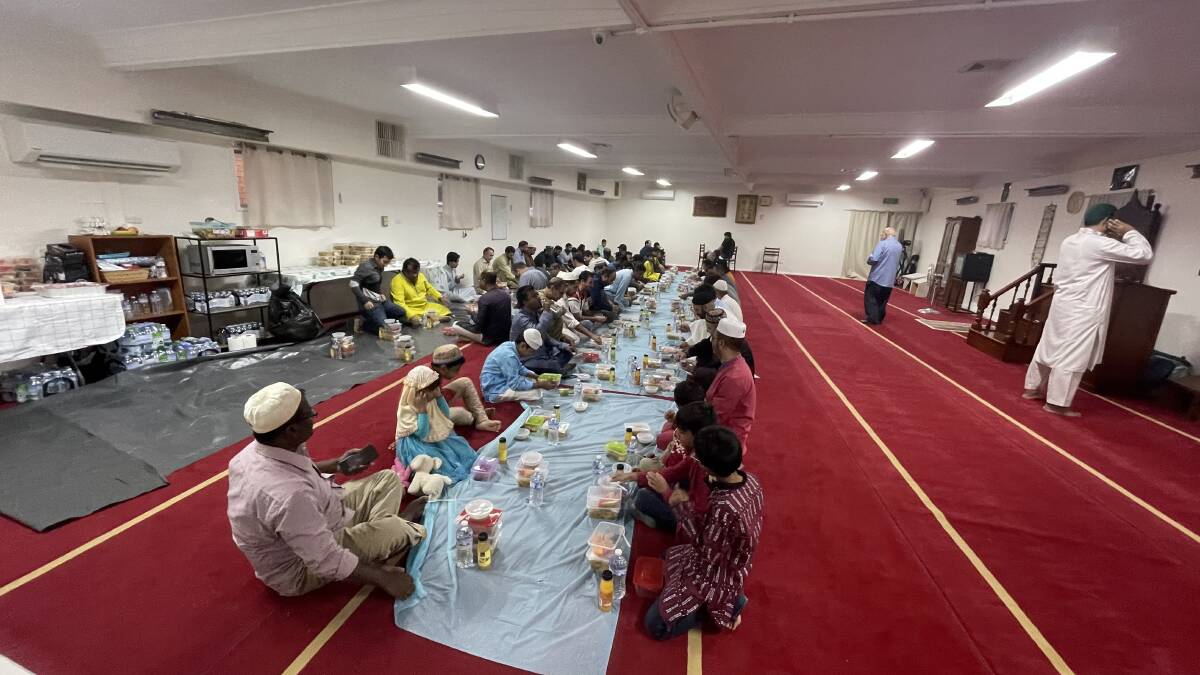 Eating iftar together. Picture by Allan Wilson