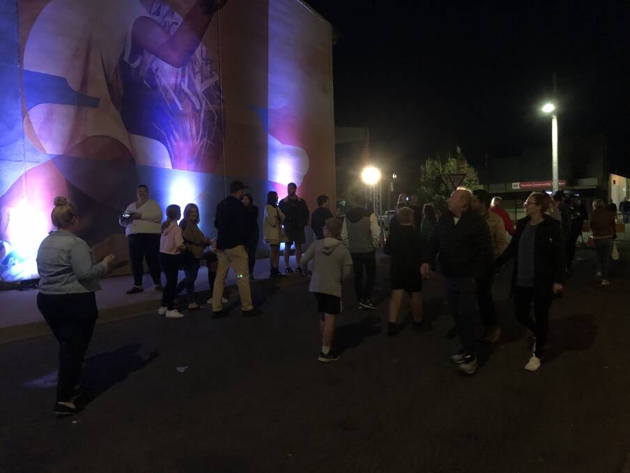 NIGHT LIGHTS: Griffith poured into the street to enjoy the food, drink and art of the festival. PHOTO: Cai Holroyd