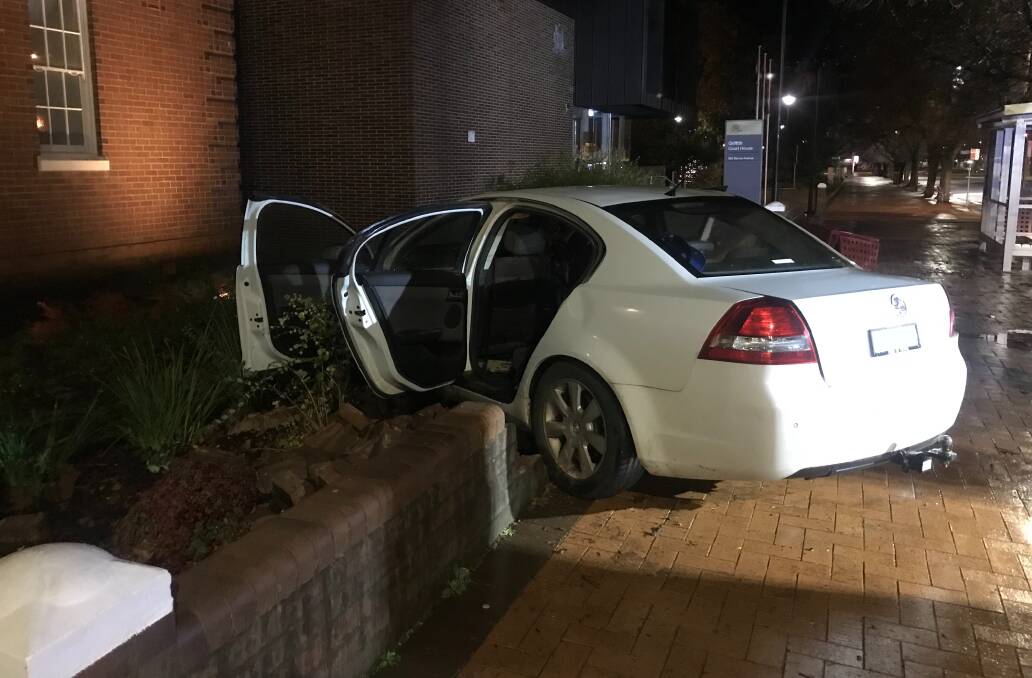 ADJOURNED: The vehicle collided with a tree and the garden outside the courtroom in the early hours of the morning. PHOTO: Contributed