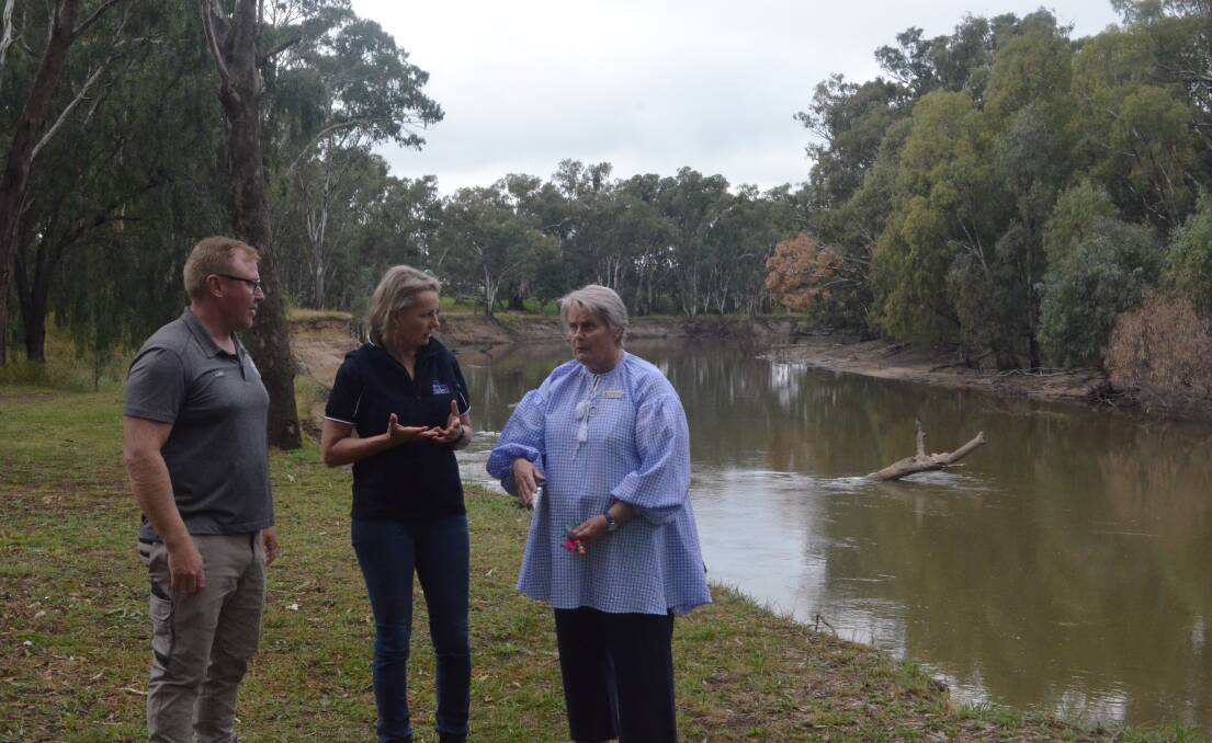 RIVER FLOWS IN YOU: Luke Payne, Sussan Ley, and Ruth McCrae at the caravan park, overlooking the Murrumbidgee River. PHOTO: Cai Holroyd