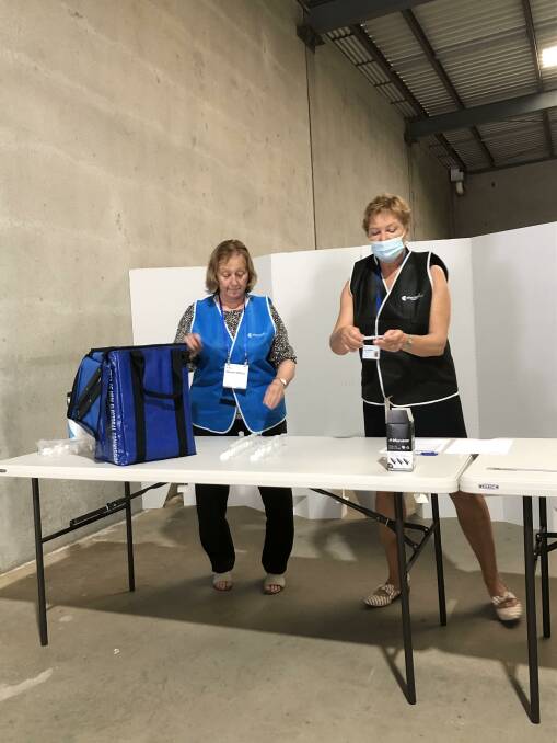 SCRUTINISED: Carol Taylor (left) and Jane Moxon drew the ballot. PHOTO: Cai Holroyd