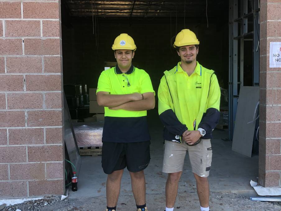 WORKING HARD: Tyrone Sloane and Rodney Gibbs are learning on the job at the new Griffith Base Hospital redevelopment. PHOTO: Cai Holroyd
