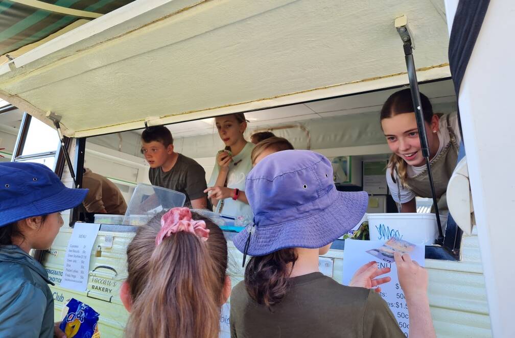 ORDER UP: Students from Griffith East Public School sold baked goods from the van, raising over $1000. PHOTO: Contributed