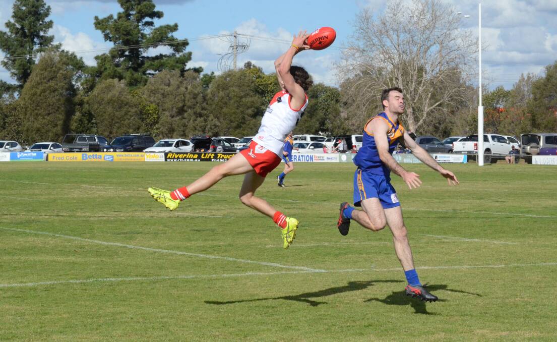 LEAP OF FAITH: The Griffith Swans took out a 29-point victory over the Narrandera Eagles in their match, directly after the Big Freeze. PHOTO: Cai Holroyd