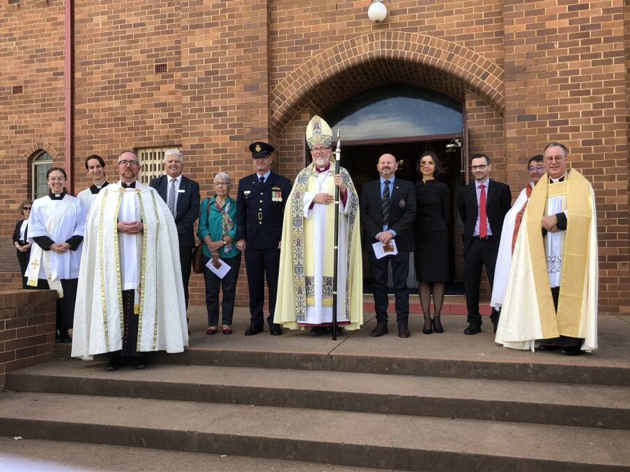 A KIND DONATION: Members of the church and representatives from the Australian War Memorial stand together to commemorate the gift. Photo: Cai Holroyd. 