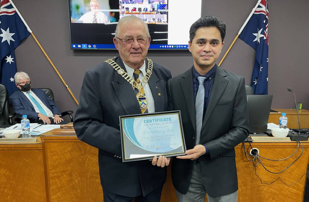 APPRECIATED: Mayor John Dal Broi and Griffith City Council gifted Doctor Maung Win a certificate of appreciation in recognition of his dedicated work. PHOTO: Contributed