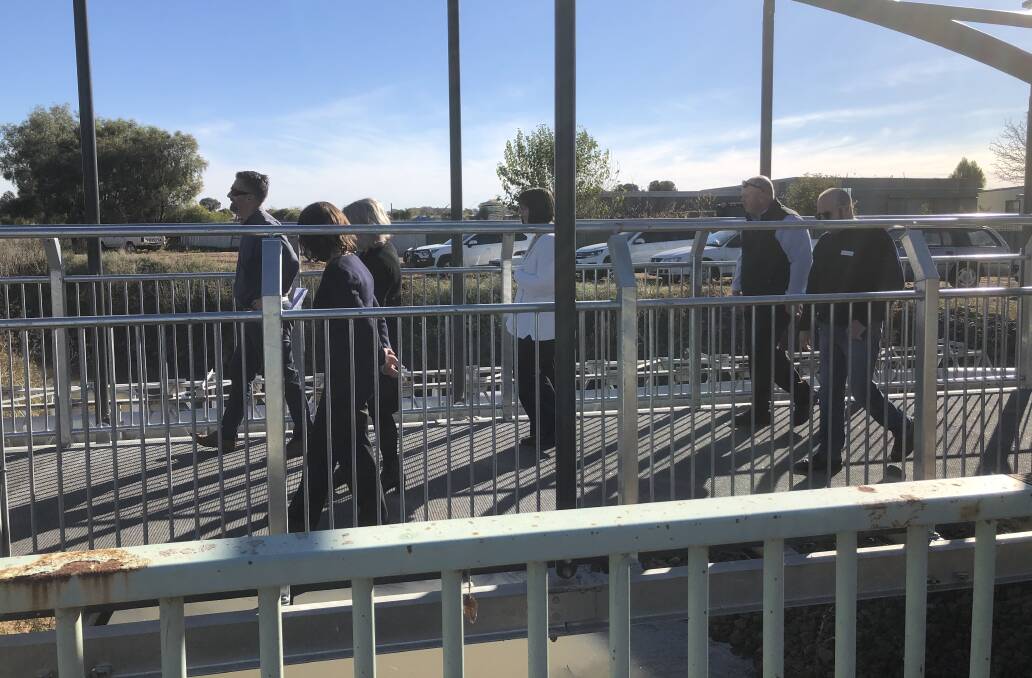 BRIDGE ON THE RIVER J: Councillors and development staff walk over the new bridge for Hanwood's cycleway. PHOTO: Cai Holroyd