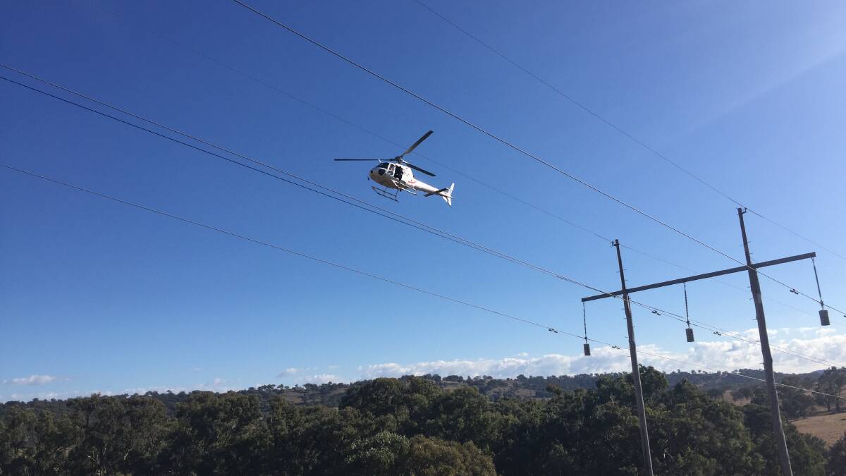 CHOPPER: TransGrid will be conducting bushfire safety flyovers for the next weeks, so property owners are encouraged to look after their livestock. PHOTO: Contributed