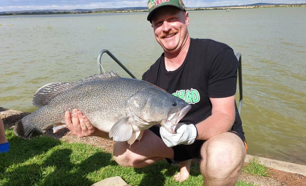 PRIZE CATCH: Tom Armstrong with one of the biggest fish, just before release. PHOTO: Cai Holroyd