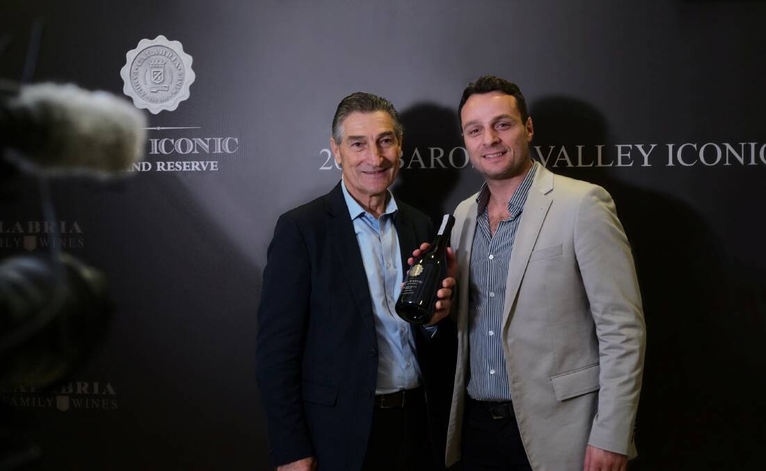 BLUE RIBBON: Bill and Andrew Calabria with their prize-winning shiraz. PHOTO: Contributed