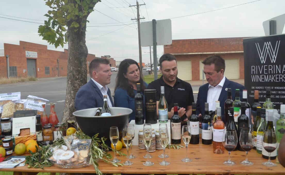PINOT GRIGIO: MP Dugald Saunders, Carrah Lymer, Andrew Calabria and MP Paul Toole examining some of the wines that will be on offer at the soon-to-be-opened Food and Wine Hub. PHOTO: Cai Holroyd