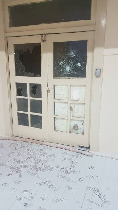 BROKEN GLASS: 27 windows of Woodside Hall were broken along with the damage to a vintage cash register, the walls and floor. PHOTO: Contributed