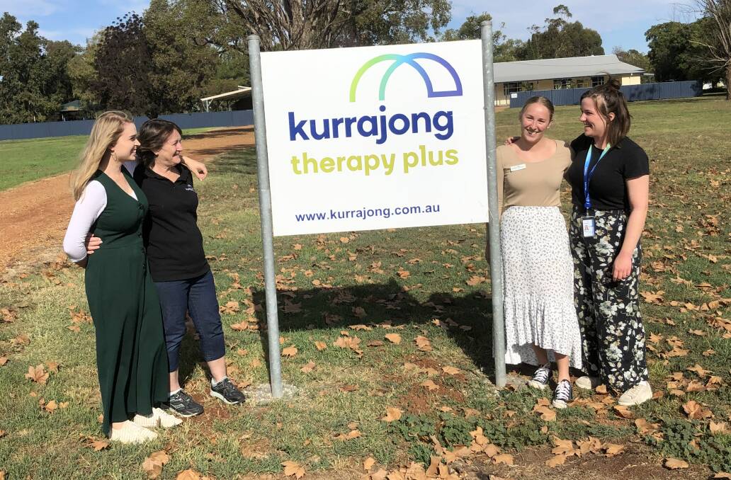 SIGN OF THINGS TO COME: The Kurrajong Therapy Plus team outside with their new sign. PHOTO: Cai Holroyd