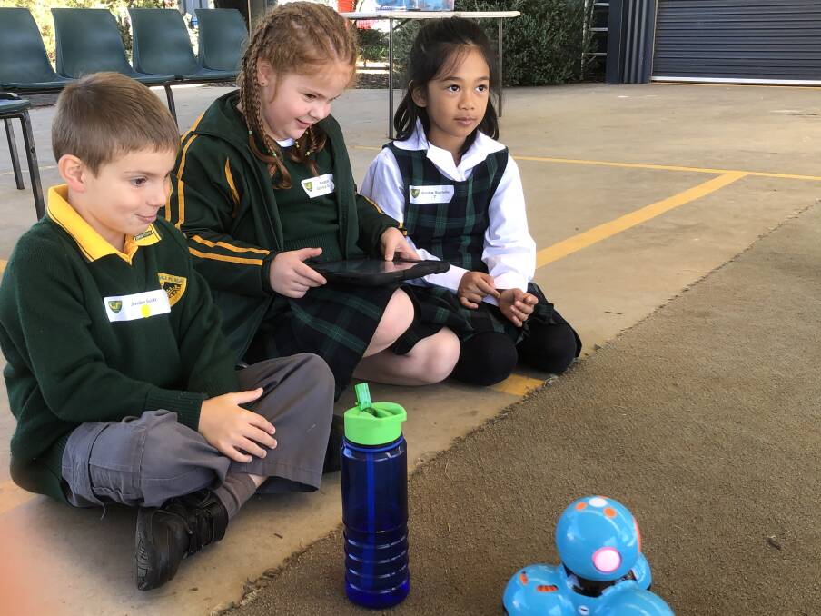 BEEP BOOP: Students were captivated while experimenting with the Dash Bots, robots equipped with a wide array of sensors. PHOTO: Cai Holroyd