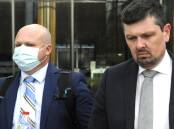 Mark Wallis, left, leaves court with his solicitor, Michael Kukulies-Smith, on a previous ocassion. Picture: Blake Foden