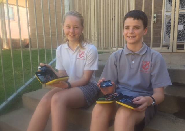 CODE CENTRIC: Sophie Webb and Daniel Mitchell from Griffith North Public School loved learning how to code as part of the NSW VSA Trial. PHOTO: Andy Arnold
