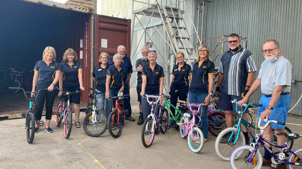 ON THEIR WAY: Members of the Griffith Soroptimists pose excitedly with some of the bikes that are set to be shipped to Samoa later this month. PHOTO: Lizzie Gracie 