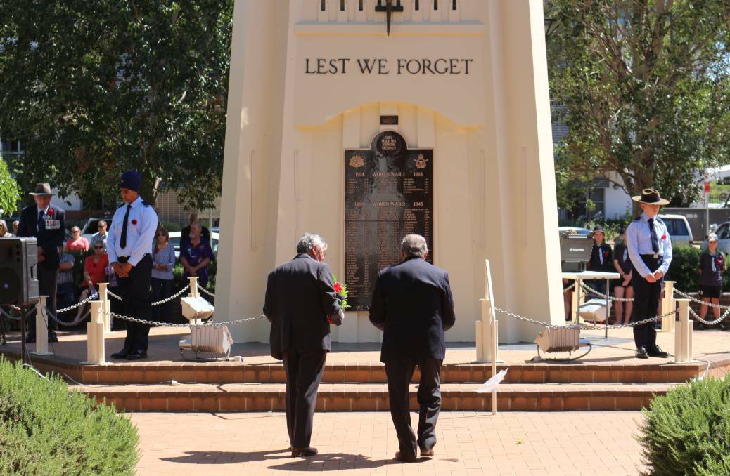 A DAY OF REFLECTION: Griffith RSL sub-branch members lay wreaths at the Memorial Park Cenotaph, paying their respects to the veterans of Griffith in a previous Remembrance Day ceremony. PHOTO: FILE