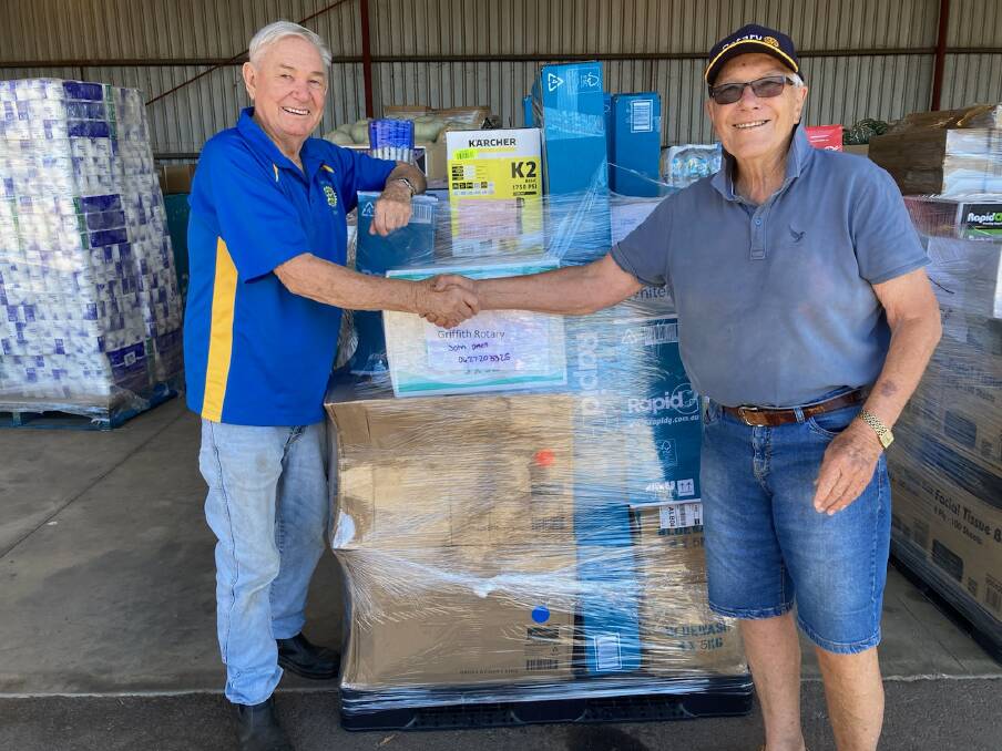 A WORTHY CAUSE: Brian Sainty and David Hammond pictured amongst items ready to be driven up north to flood victims. PHOTO: Supplied