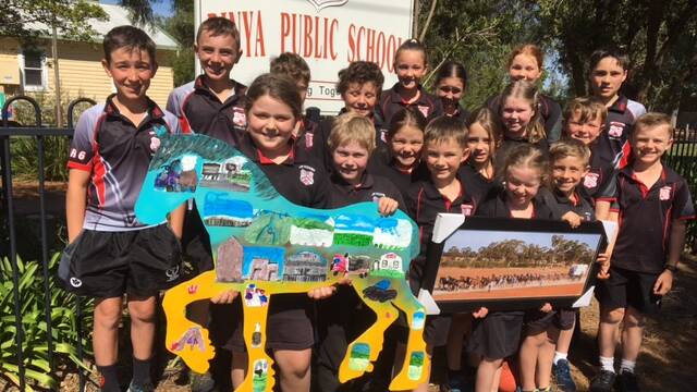 HORSING AROUND: Students of Binya Public School pose with their winning entry. PHOTO: Contributed