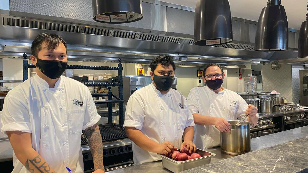 A BUSY KITCHEN: Chefs Mark Guzman, Fahim Ferdous and Giuseppe Migliaccio have started preparations in the kitchen for the weekend ahead. PHOTO: Lizzie Gracie 