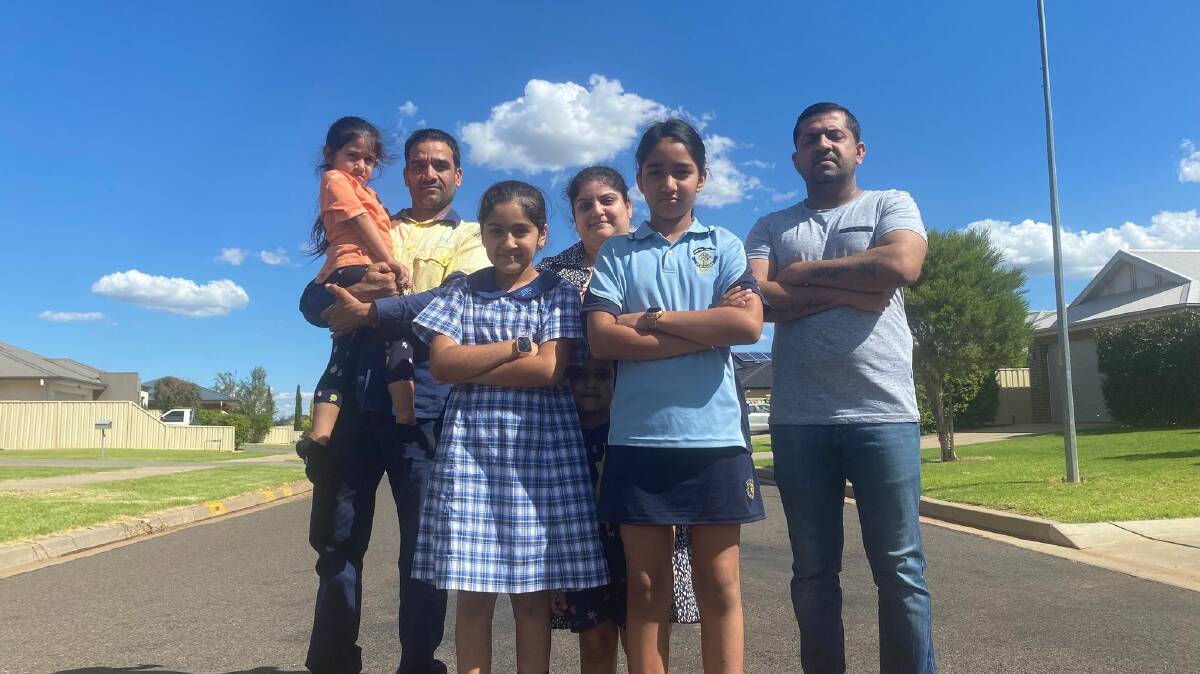 NOT GOOD ENOUGH: Gavy and Tarsem Singh, Gurvinder and Ravinder Janday, Keerat Kaur Janday and Rueben and Navnoor Mahal are just one family out of many whose children have to walk a considerable distance on roads to get to their nearest bus stop. PHOTO: Lizzie Gracie 