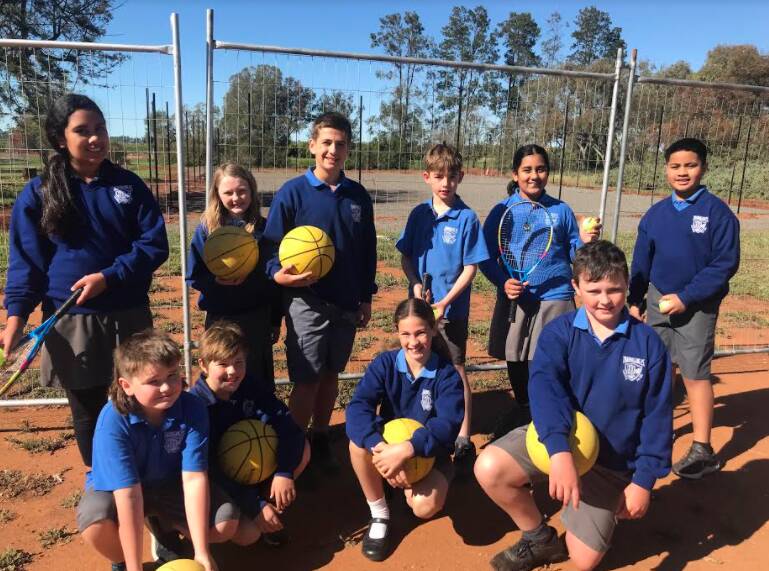 READY TO PLAY: Tharbogang PS students are ready and waiting for the new multisport court to open. PHOTO: Cheryle Glyde 