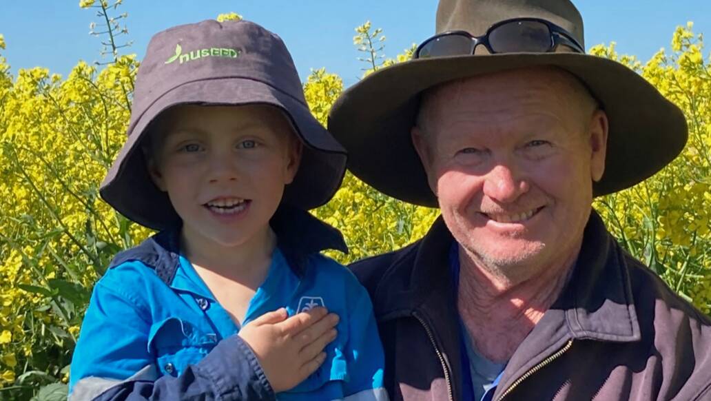 MANOLA YIELDING GREAT RESULTS: Colleambaly farmer Ken Brain with his grandson Jaxon on his manola farm. PHOTO: Supplied