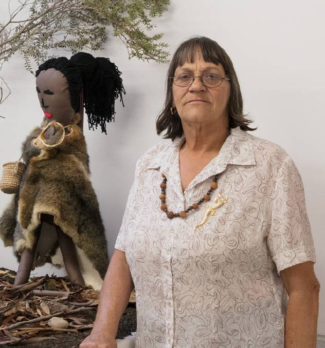 Wiradjuri Elder Aunty Gail Manderson at Charles Sturt University Wagga with her artwork 'Lockie, Fluer and the Emu'. PHOTO: James Farley