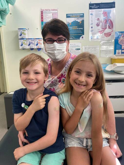 ALL SMILES FOR VACCINATION: Blair Aitken and Lylah Aitken received their first doses of the Pfizer COVID-19 vaccine from nurse Jodie Gardner at the Griffith Respiratory Clinic and Vaccination Hub at Your Health Griffith. PHOTO: Karlie Aitken