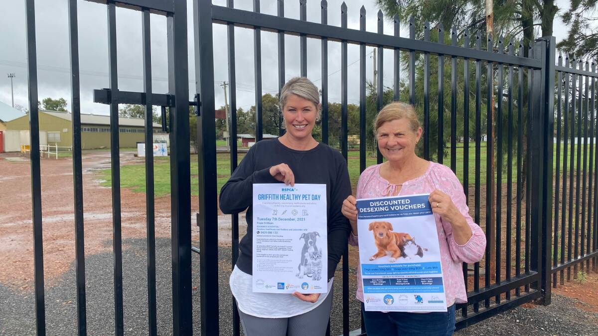 AN EXCITING DAY: Rachel Carlon and Virginia Tropeano from Friends of Griffith Pound pose outside the entrance to Griffith Showgrounds. PHOTO: Lizzie Gracie