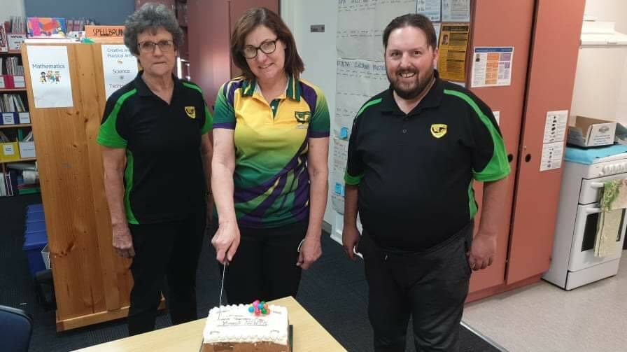 A JUST REWARD: Teachers at Yoogali Public School cut a cake gifted to the school from the NSW Teachers Federation in celebration of World Teachers Day. PHOTO: Supplied 