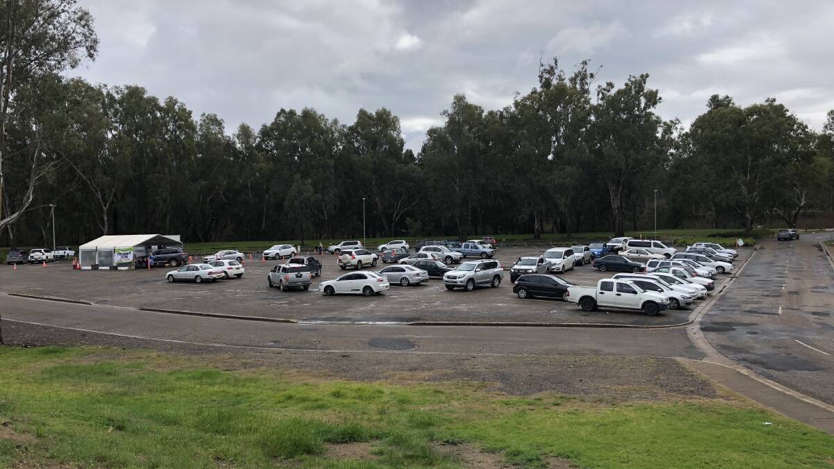 COVID TESTING: Cars lined up at the Wagga beach COVID testing hub on Friday morning, following news of three exposure sites in the Riverina. Picture: Emily Wind