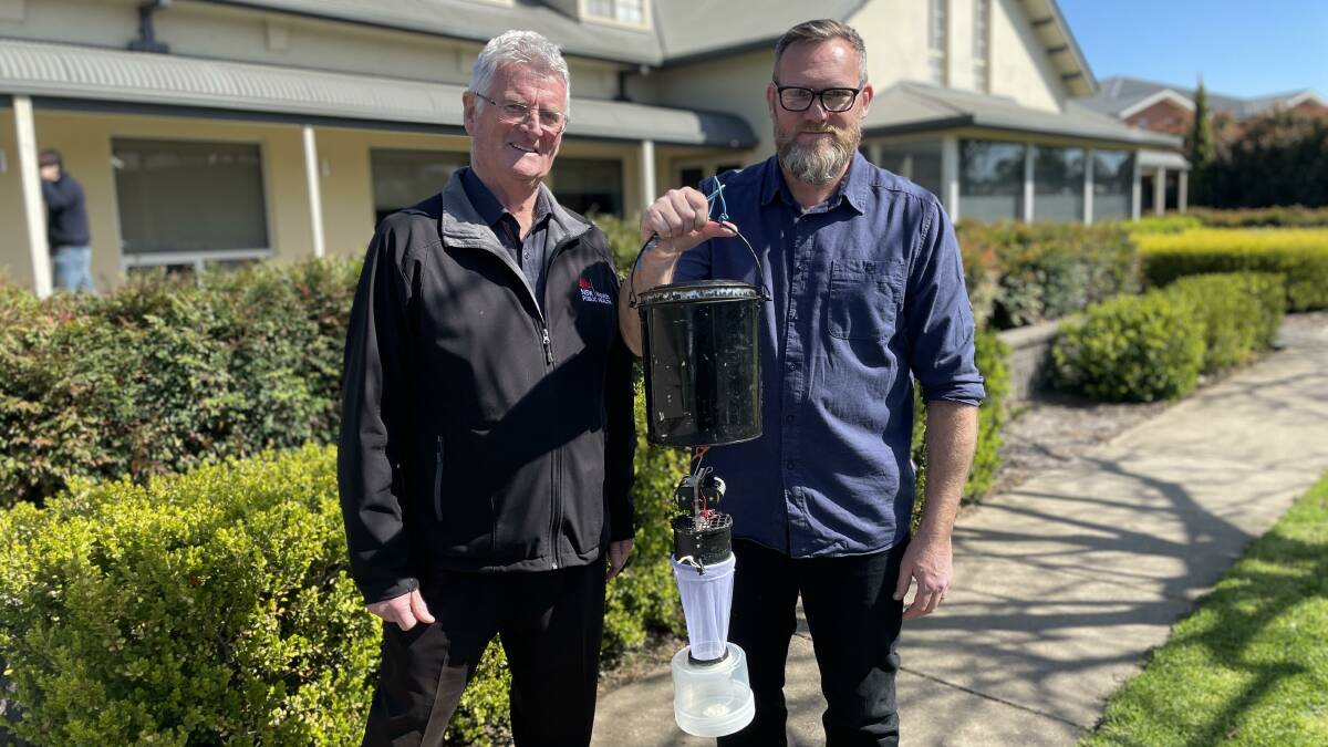 Tony Burns (left) and Cameron Webb, here with a mosquito trap, each say people should prepare itself for a high rate of mosquitoes this summer with another La Nina wet weather event coming. Photo by Tim Piccione