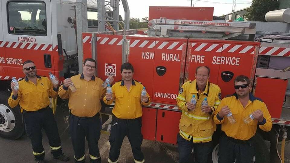 FUNDRAISING: Hanwood Fire Brigade captain Adam Bertolissi (centre) said his team has been using Return and Earn since 2018. PHOTO: Contributed