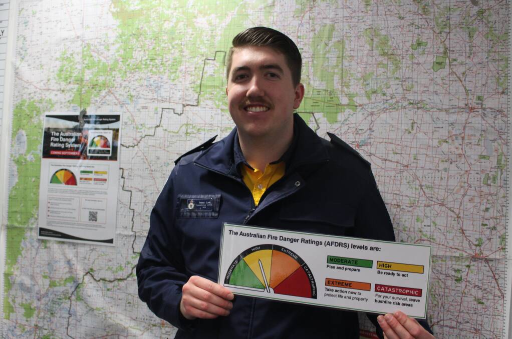 NEW AND IMPROVED: MIA RFS operational officer Isaac Lee with the new Fire Danger Ratings. PHOTO: Vincent Dwyer