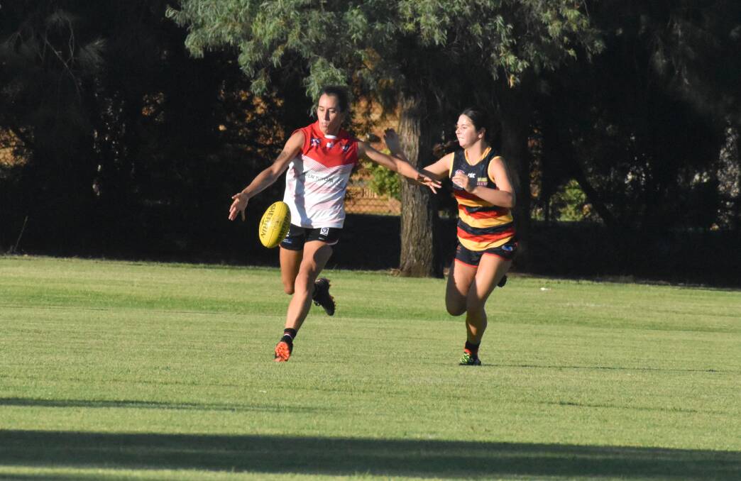 Griffith Swans Grace Buchan gets a kick away in round one. Picture by Liam Warren