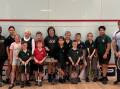 Coleambally Squash Club treasurer Cate Hardy pictured with Neil Burke and junior players. Picture supplied
