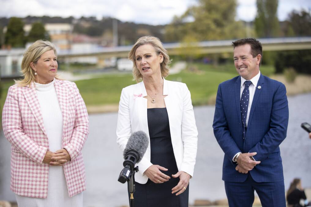 Nichole Overall (centre) with Minister for Women Bronnie Taylor (left) and Deputy Premier Paul Toole in Queanbeyan on Saturday. Picture: Keegan Carroll