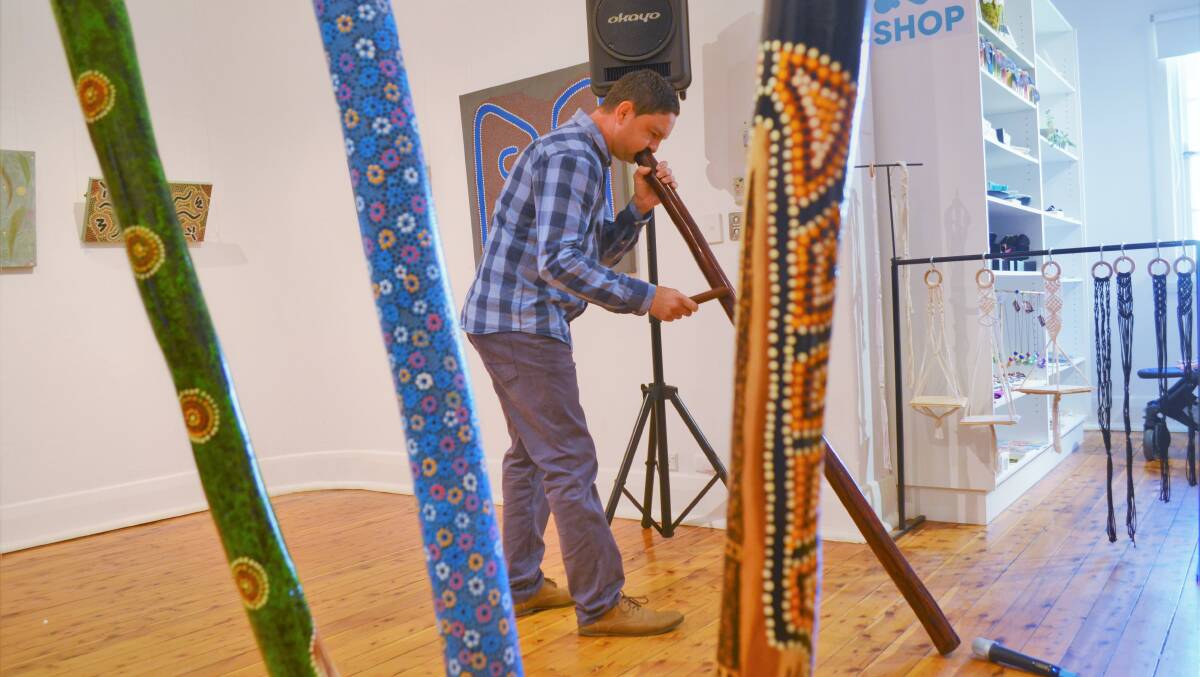 MUSICAL: Ben Curphey gives a didgeridoo performance at the opening of the Murru exhibition. Picture: Kenji Sato