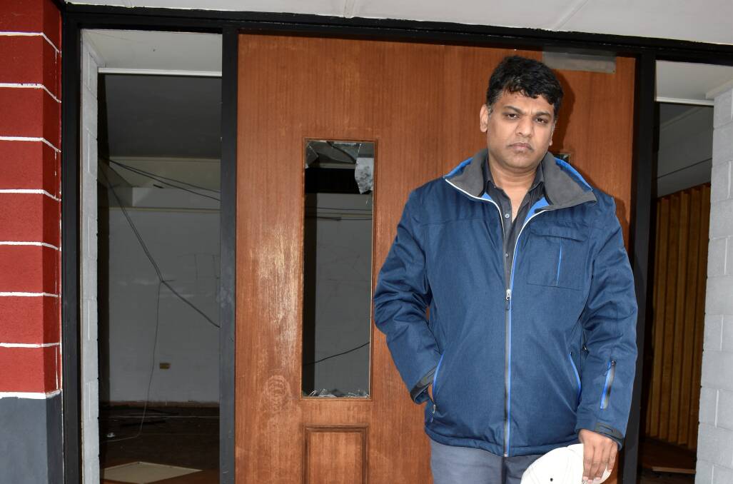 DEVASTATED: Imran Syed was horrified to discover vandals had trashed his building on 161 Remembrance Drive, just three months after the last attack. PHOTO: Kenji Sato
