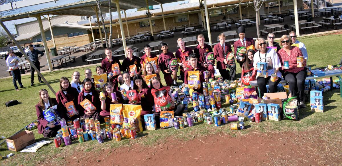 CAT HELPS DOGS: Marian Catholic College's Community Action Team rallied the school to bring as much dog food as possible for Needy Paws. PHOTO: Kenji Sato