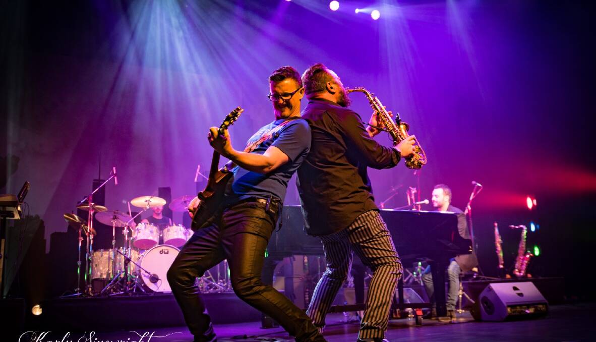ROCK ON: Robert Fattore shreds his heart out on the guitar alongside his friend and band saxophonist Dave Zee at the Australian Billy Joel tribute show. PHOTO: Karly Sivewright