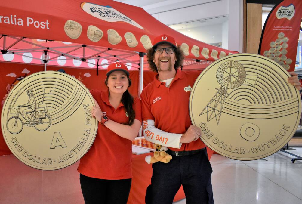 POSTIES: Maddie Hamley and David Coghlan showed off some of the new coins at Griffith Central. PHOTO: Kenji Sato