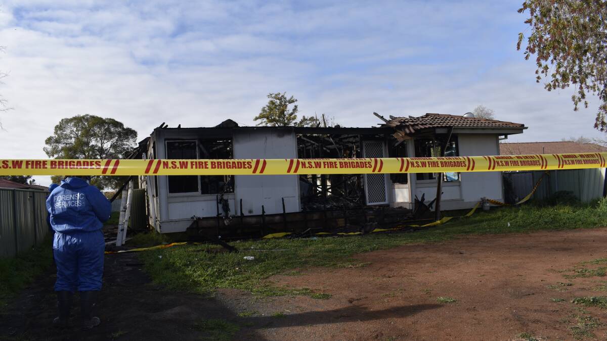 Forensic police investigating cause of house fire